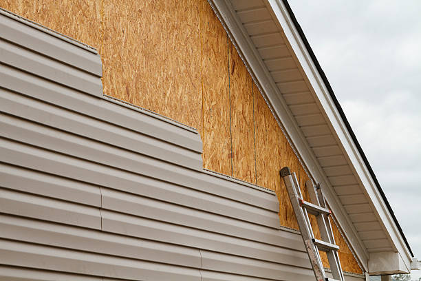 Professional Siding Installation technician working in Arona, PA